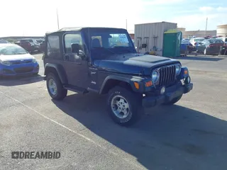 2002 Jeep Wrangler Sport z VIN 1J4FA49SX2P760671, wystawiony jako IAAI lot #41861841 z przebiegiem 125 728 mil mil oraz . Historia ofert i sprzedaży dostępna na DreamBid. Obrazek 1.