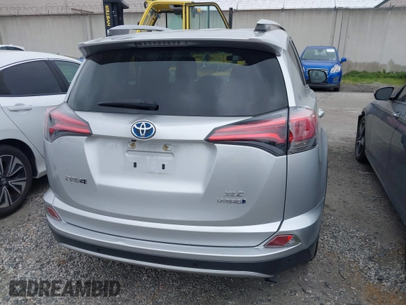 2016 Toyota RAV4 Hybrid XLE with VIN JTMRJREVXGD029019, listed as a IAAI auction lot 42021530 with 74,400 mi miles. Bid and sale history available at carsss.com. Image 17.