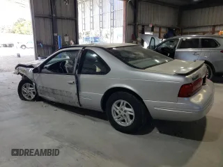 1997 Ford Thunderbird LX z VIN 1FALP62W1VH123205, wystawiony jako Copart lot #76107654 z przebiegiem 120 225 mil mil oraz Szkoda całkowita • Salvage title. Historia ofert i sprzedaży dostępna na DreamBid. Obrazek 2.