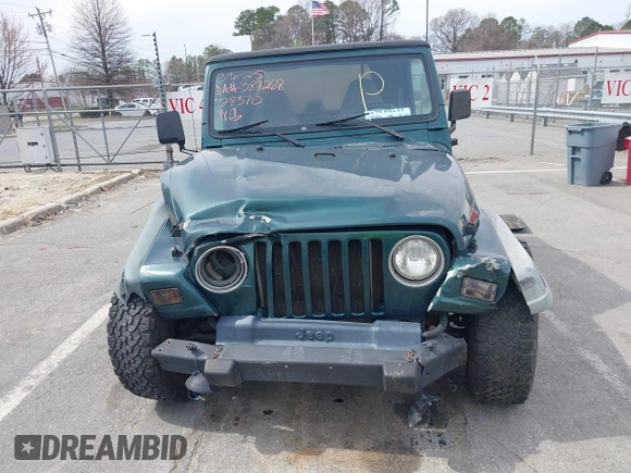 2000 Jeep Wrangler SE with VIN 1J4FA29P0YP728370, listed as a IAAI auction lot 41788463 with 186,995 mi miles. Bid and sale history available at carsss.com. Image 12.
