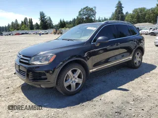 2012 Volkswagen Touareg Sport with VIN WVGFK9BP2CD001355, listed as a Copart auction lot 61224105 with 149,508 mi miles and Salvage title. Bid and sale history available at DreamBid. Image 1.