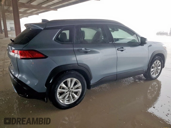 2023 Toyota Corolla Cross LE with VIN 7MUBAAAG4PV042580, listed as a Copart auction lot 63797305 with 59,576 mi miles and Salvage title. Bid and sale history available at DreamBid. Image 3.