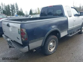 2000 Ford F-150 XL with VIN 1FTRX18L8YKA72409, listed as a IAAI auction lot 41928360 with 167,251 mi miles. Bid and sale history available at carsss.com. Image 4.