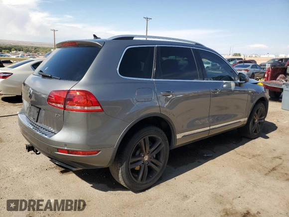 2013 Volkswagen Touareg Sport с VIN WVGEP9BP0DD010408, выставлен на аукционе Copart как лот 75854084 с пробегом 159 863 миль миль и Списание • Salvage title. История ставок и продаж доступна на DreamBid. Изображение 3.