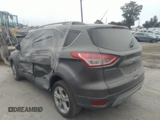 2014 Ford Escape SE with VIN 1FMCU0GXXEUA77765, listed as a IAAI auction lot 40158558 with 88,373 mi miles. Bid and sale history available at carsss.com. Image 3.