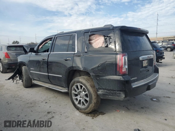 2015 GMC Yukon Denali with VIN 1GKS1CKJ2FR699959, listed as a Copart auction lot 42035195 with 0 mi miles and Salvage Title. Bid and sale history available at carsss.com. Image 2.