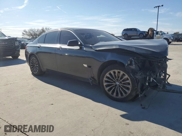 2011 BMW 7 Series 740i with VIN WBAKA4C57BC612487, listed as a Copart auction lot 82633554 with 0 mi miles and Salvage Title. Bid and sale history available at carsss.com. Image 4.