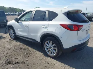 2015 Mazda CX-5 Grand Touring with VIN JM3KE2DY5F0498718, listed as a IAAI auction lot 42070000 with 129,327 mi miles. Bid and sale history available at carsss.com. Image 3.