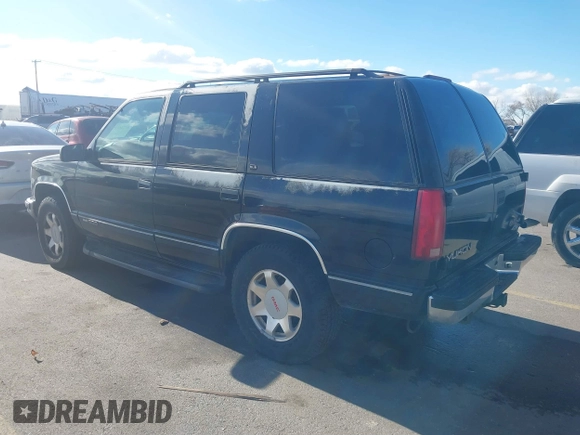 1997 GMC Yukon with VIN 1GKEK13R3VJ759103, listed as a IAAI auction lot 41726127 with 218,500 mi miles. Bid and sale history available at carsss.com. Image 3.