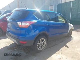 2017 Ford Escape SE with VIN 1FMCU9GD2HUA10771, listed as a IAAI auction lot 39225590 with 56,324 mi miles and . Bid and sale history available at DreamBid. Image 4.