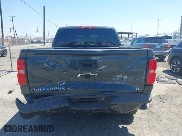 2018 Chevrolet Silverado 1500 LT with VIN 3GCUKREC1JG511846, listed as a IAAI auction lot 42024170 with 121,532 mi miles and . Bid and sale history available at DreamBid. Image 16.