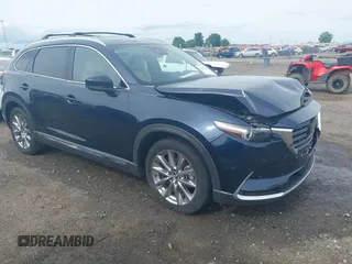 2020 Mazda CX-9 Grand Touring with VIN JM3TCBDY1L0402718, listed as a IAAI auction lot 42355511 with 87,205 mi miles and . Bid and sale history available at DreamBid. Image 1.