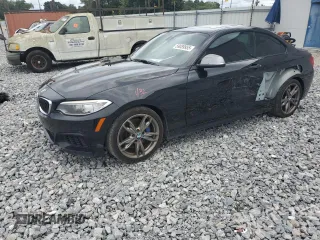 2015 BMW 2 Series M235i with VIN WBA1J7C55FV289435, listed as a Copart auction lot 59089955 with 122,328 mi miles and Salvage title. Bid and sale history available at DreamBid. Image 1.