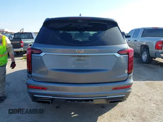 2020 Cadillac XT6 FWD Premium Luxury z VIN 1GYKPCRS8LZ129799, wystawiony jako IAAI lot #41602536 z przebiegiem 96 865 mil mil oraz . Historia ofert i sprzedaży dostępna na DreamBid. Obrazek 16.