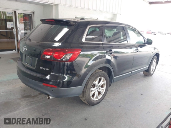 2014 Mazda CX-9 Touring with VIN JM3TB2CA2E0446267, listed as a IAAI auction lot 42196512 with 98,670 mi miles and . Bid and sale history available at carsss.com. Image 4.