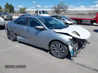 2019 Honda Insight Touring with VIN 19XZE4F93KE007489, listed as a IAAI auction lot 41943334 with 118,689 mi miles and . Bid and sale history available at carsss.com. Image 1.