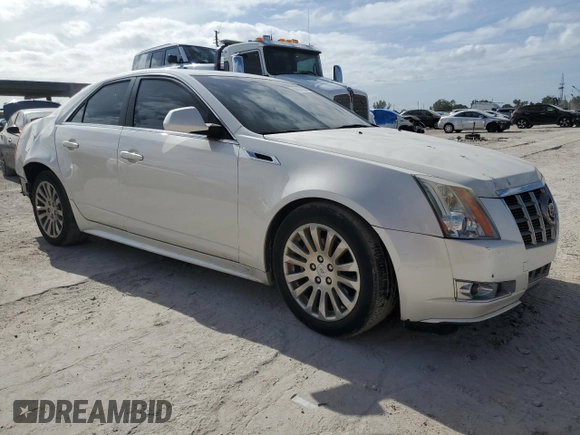 2012 Cadillac CTS Performance with VIN 1G6DJ5E3XC0157881, listed as a Copart auction lot 86434934 with 60,943 mi miles and Salvage Title. Bid and sale history available at DreamBid. Image 4.
