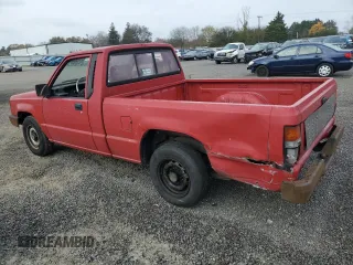 1991 Mitsubishi Mighty Max z VIN JA7FL24W2MP026041, wystawiony jako Copart lot #79159244 z przebiegiem 219 903 mil mil oraz Szkody całkowita. Historia ofert i sprzedaży dostępna na DreamBid. Obrazek 2.