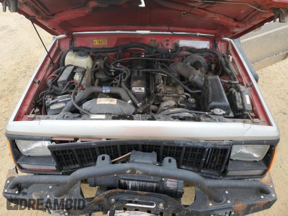 1993 Jeep Cherokee Sport with VIN 1J4FJ67S6PL580133, listed as a Copart auction lot 43230005 with 122,173 mi miles and Salvage Title. Bid and sale history available at carsss.com. Image 12.