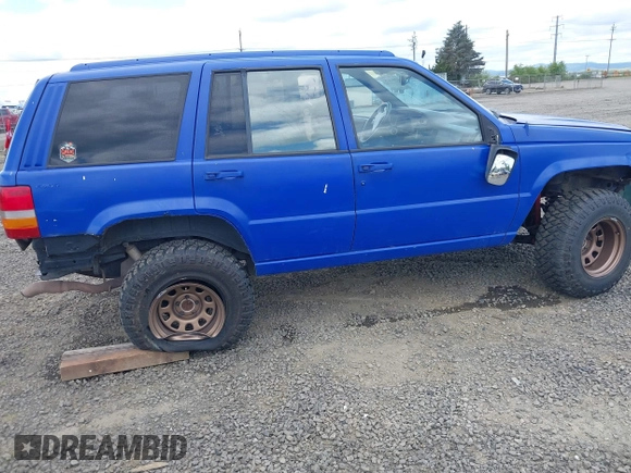1996 Jeep Grand Cherokee Laredo with VIN 1J4GZ58YXTC329037, listed as a IAAI auction lot 42051175 with 314,571 mi miles and . Bid and sale history available at DreamBid. Image 6.