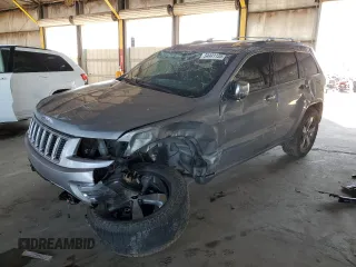 2016 Jeep Grand Cherokee Overland with VIN 1C4RJFCG0GC490710, listed as a Copart auction lot 54441135 with 105,378 mi miles and Salvage title. Bid and sale history available at DreamBid. Image 1.