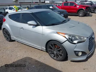 2014 Hyundai Veloster Turbo with VIN KMHTC6AE6EU190531, listed as a IAAI auction lot 42838650 with 187,179 mi miles and . Bid and sale history available at DreamBid. Image 1.