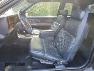 1988 Cadillac Eldorado z VIN 1G6EL1155JU600524, wystawiony jako Copart lot #59505125 z przebiegiem 110 972 mil mil oraz Szkoda całkowita • Salvage title. Historia ofert i sprzedaży dostępna na DreamBid. Obrazek 7.