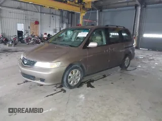 2003 Honda Odyssey EX-L with VIN 5FNRL18923B117592, listed as a IAAI auction lot 41546119 with 212,755 mi miles and . Bid and sale history available at DreamBid. Image 2.