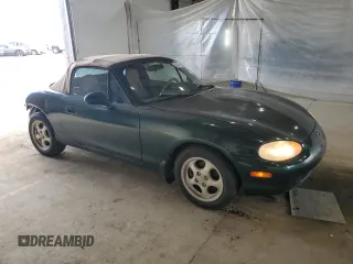 1999 Mazda MX-5 Miata z VIN JM1NB353XX0111850, wystawiony jako Copart lot #53076805 z przebiegiem 128 707 mil mil oraz Szkoda całkowita • Salvage title. Historia ofert i sprzedaży dostępna na DreamBid. Obrazek 4.