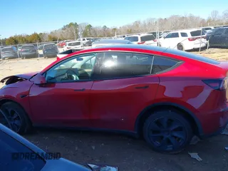 2023 Tesla Model Y Long Range with VIN 7SAYGDEE8PF709459, listed as a IAAI auction lot 41334108 with 51,544 mi miles. Bid and sale history available at carsss.com. Image 13.