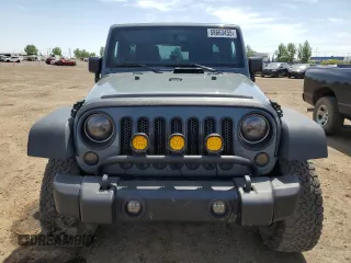 2014 Jeep Wrangler Unlimited Sahara with VIN 1C4BJWEG7EL228307, listed as a Copart auction lot 58663455 with 188,024 mi miles and Salvage title. Bid and sale history available at DreamBid. Image 5.