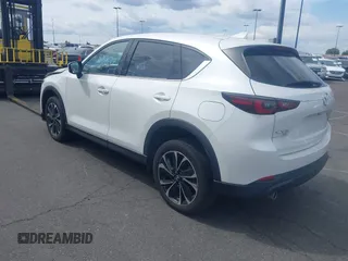 2023 Mazda CX-5 2.5 S Premium Plus Package with VIN JM3KFBEM4P0112803, listed as a IAAI auction lot 41588872 with 25,087 mi miles. Bid and sale history available at carsss.com. Image 3.