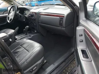 2004 Jeep Grand Cherokee Limited with VIN 1J8GW58N04C186548, listed as a IAAI auction lot 41949015 with 244,505 mi miles. Bid and sale history available at carsss.com. Image 5.