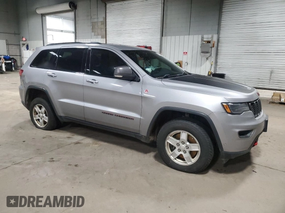 2019 Jeep Grand Cherokee Trailhawk with VIN 1C4RJFLT6KC849550, listed as a Copart auction lot 84006364 with 54,518 mi miles and Salvage title. Bid and sale history available at DreamBid. Image 4.
