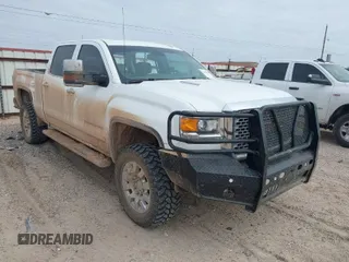 2015 GMC Sierra 2500HD available WiFi Denali with VIN 1GT120E84FF642823, listed as a IAAI auction lot 41593286 with 148,038 mi miles. Bid and sale history available at carsss.com. Image 1.