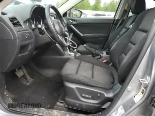 2014 Mazda CX-5 Touring z VIN JM3KE4CY0E0407169, wystawiony jako Copart lot #57877215 z przebiegiem 168 277 mil mil oraz Szkoda całkowita • Salvage title. Historia ofert i sprzedaży dostępna na DreamBid. Obrazek 7.