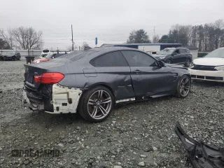 2015 BMW M4 with VIN WBS3R9C54FK330180, listed as a Copart auction lot 40706044 with 69,474 mi miles. Bid and sale history available at carsss.com. Image 3.