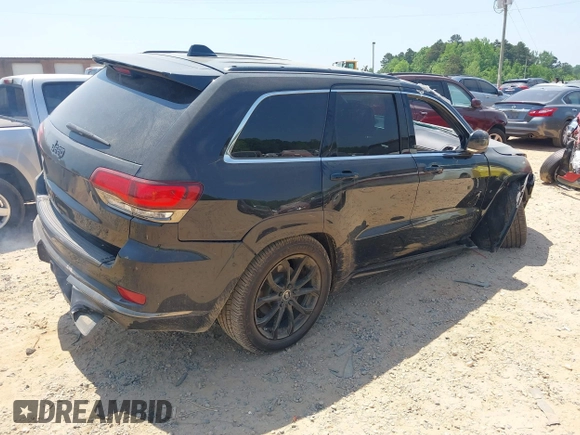 2016 Jeep Grand Cherokee Overland with VIN 1C4RJFCG5GC408390, listed as a IAAI auction lot 42140038 with 140,507 mi miles and . Bid and sale history available at DreamBid. Image 4.