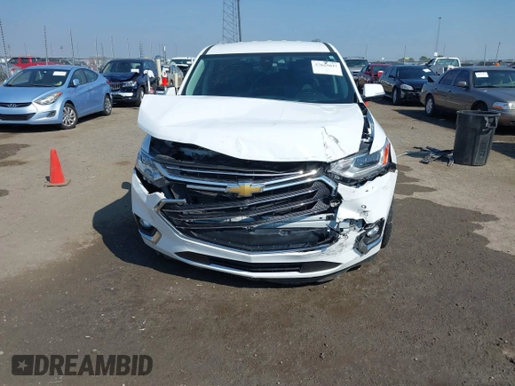 2018 Chevrolet Traverse Premier z VIN 1GNERKKW6JJ220965, wystawiony jako IAAI lot #37625637 z przebiegiem 99 072 mil mil oraz . Historia ofert i sprzedaży dostępna na DreamBid. Obrazek 13.