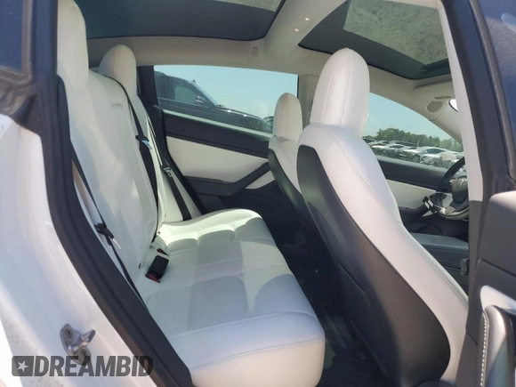 2020 Tesla Model 3 Standard Range Plus with VIN 5YJ3E1EA5LF599280, listed as a Copart auction lot 52383295 with 58,506 mi miles and Salvage Title. Bid and sale history available at DreamBid. Image 10.