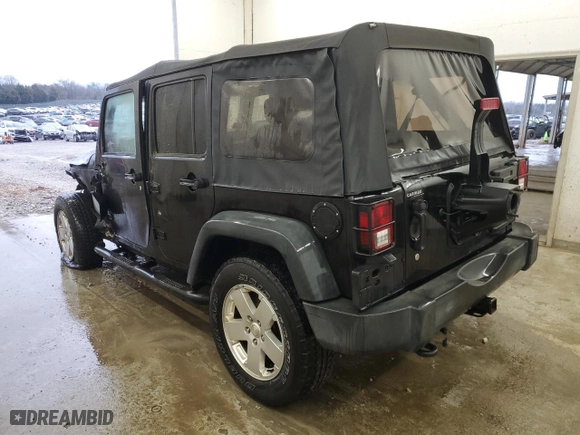 2012 Jeep Wrangler Unlimited Sport with VIN 1C4BJWDG3CL141826, listed as a Copart auction lot 42399365 with 170,022 mi miles and Salvage Title. Bid and sale history available at carsss.com. Image 2.