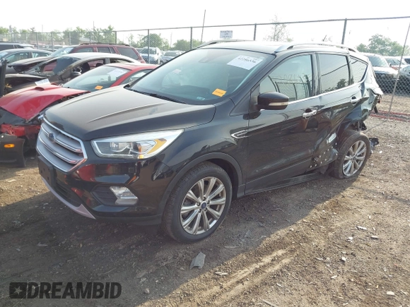 2018 Ford Escape Titanium with VIN 1FMCU9J95JUB30803, listed as a IAAI auction lot 42286536 with 63,309 mi miles and . Bid and sale history available at DreamBid. Image 18.