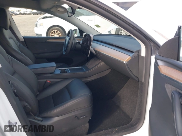 2023 Tesla Model Y Long Range z VIN 7SAYGDEE0PA128888, wystawiony jako IAAI lot #41410085 z przebiegiem 12 578 mil mil oraz . Historia ofert i sprzedaży dostępna na DreamBid. Obrazek 5.