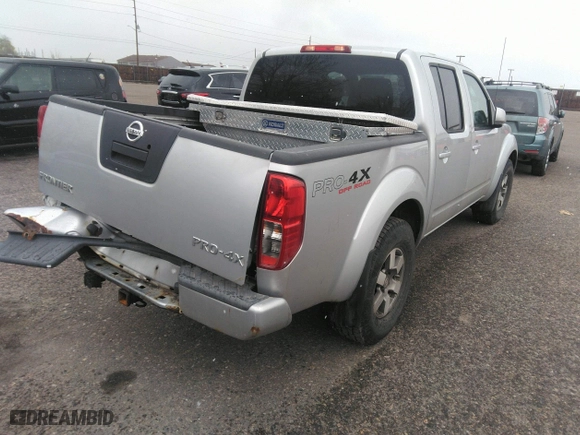 2011 Nissan Frontier PRO-4X with VIN 1N6AD0EV2BC438370, listed as a IAAI auction lot 41952484 with 217,529 mi miles. Bid and sale history available at carsss.com. Image 4.