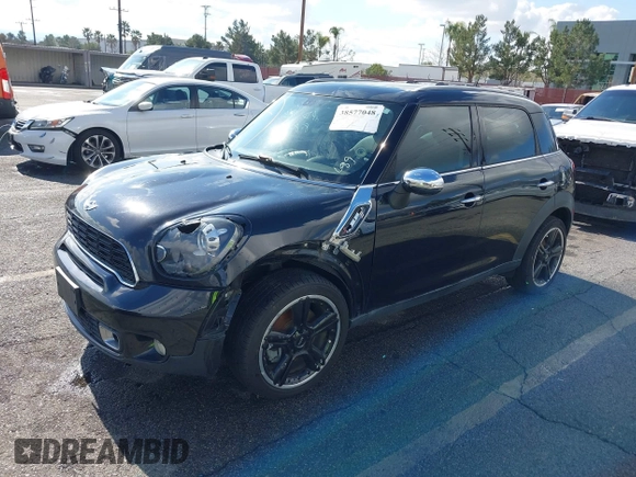 2014 MINI Countryman S with VIN WMWZC3C56EWP27880, listed as a IAAI auction lot 38577048 with 96,812 mi miles and . Bid and sale history available at DreamBid. Image 2.