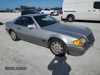 1991 MERCEDES-BENZ SL-CLASS SL with VIN WDBFA61E1MF022918, listed as a Copart auction lot 85011784 with 262,144 mi miles and Salvage Title. Bid and sale history available at DreamBid. Image 4.