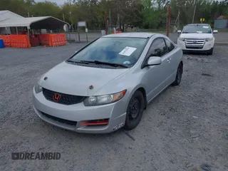 2010 Honda Civic Cpe LX with VIN 2HGFG1B60AH523854, listed as a IAAI auction lot 41953070 with 308,179 mi miles. Bid and sale history available at carsss.com. Image 2.