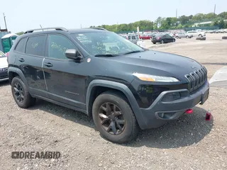 2014 Jeep Cherokee Trailhawk with VIN 1C4PJMBS8EW285276, listed as a IAAI auction lot 42408796 with Not provided miles and . Bid and sale history available at DreamBid. Image 1.
