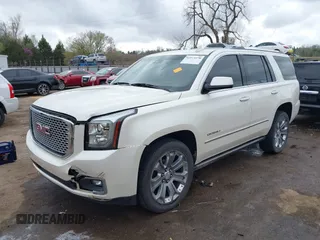 2015 GMC Yukon Denali with VIN 1GKS2CKJ7FR737165, listed as a IAAI auction lot 41914478 with 156,059 mi miles. Bid and sale history available at carsss.com. Image 2.