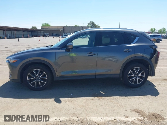 2017 Mazda CX-5 Grand Touring with VIN JM3KFADL6H0217850, listed as a IAAI auction lot 42033404 with 74,198 mi miles and . Bid and sale history available at carsss.com. Image 15.